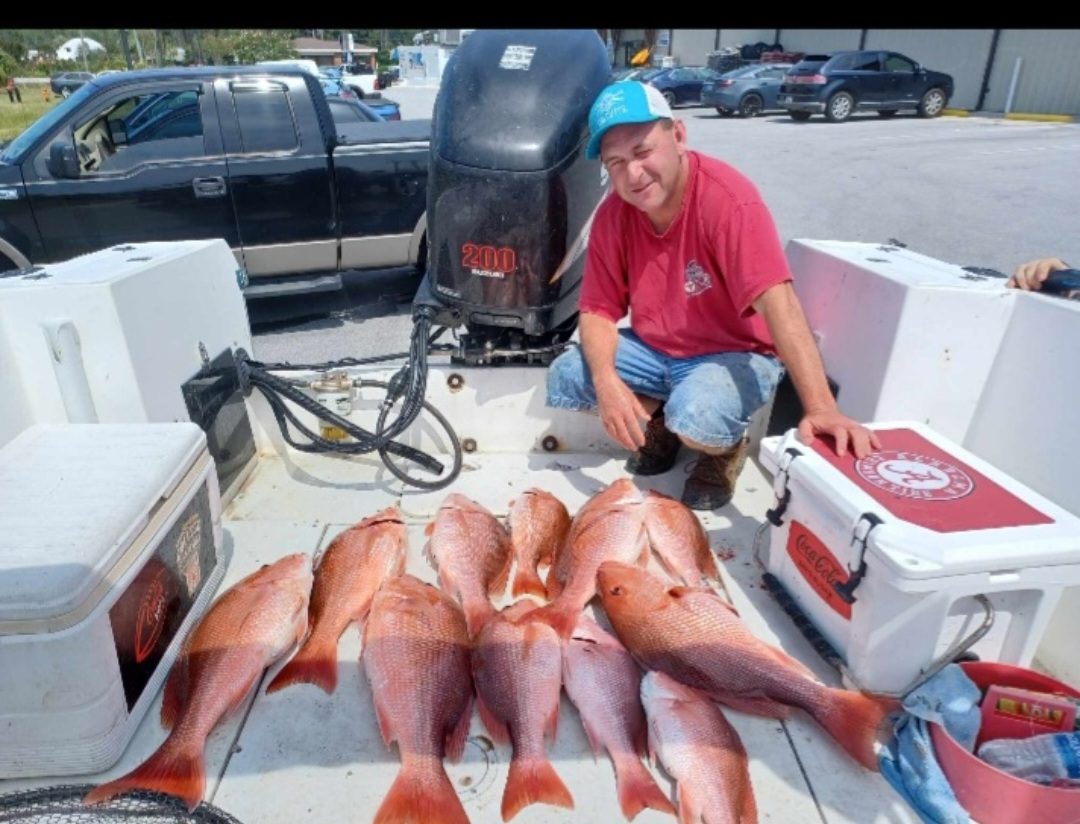 Deck full of red snapper after a Panama City bottom fishing trip